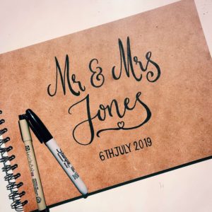 Bespoke wedding album calligraphy gift with couples names and wedding date